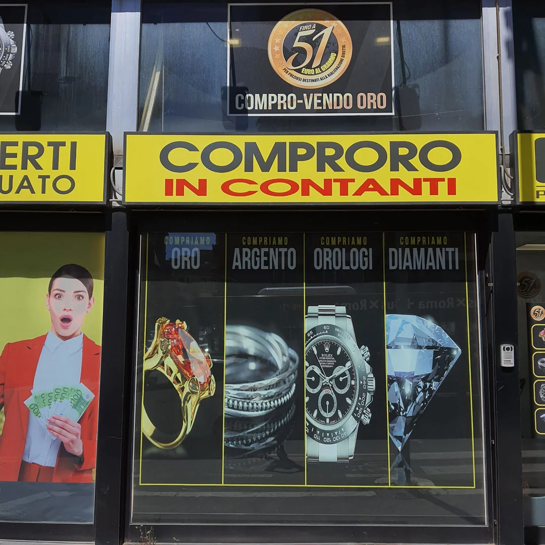 Compro oro Roma di Via Tuscolana, 309: ingresso negozio compro oro a Roma  dettaglio vetrina negozio compro oro a Roma